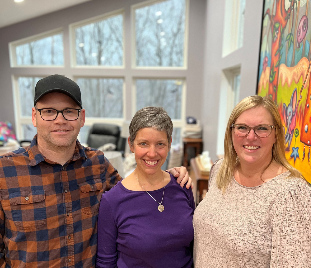 Chris and Angie Pyle in their new home with Lindsey Hamlin