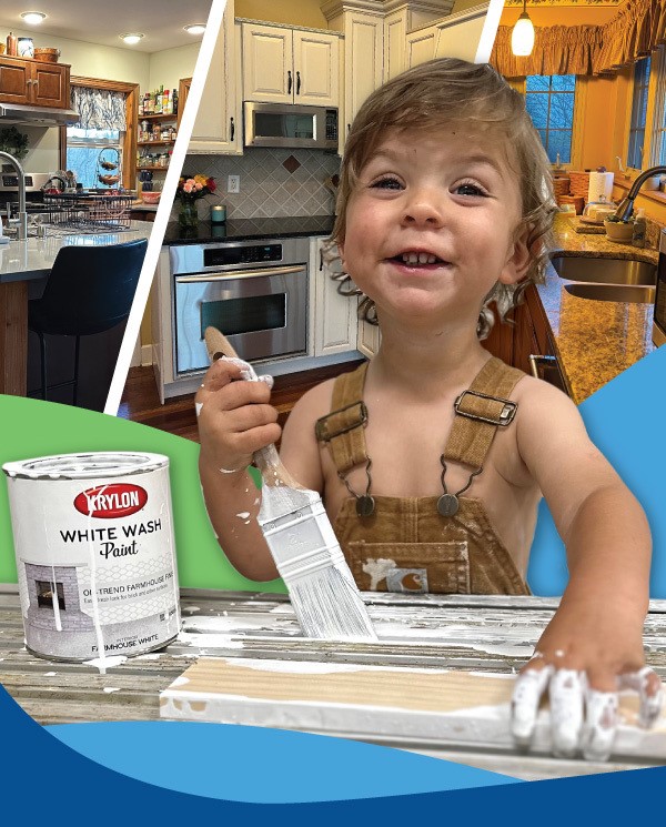 Child painting on a wooden plank.