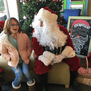 Child speaking with Santa