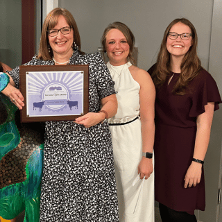 Bankers at the Dairy Barn accepting an award