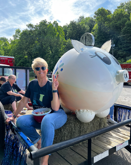 President & CEO Tammy Bobo at a local parade with bank mascot, Pork Chop. 