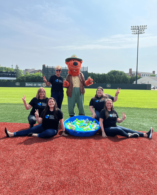 A group of bankers with Southern Ohio Copperheads mascot.