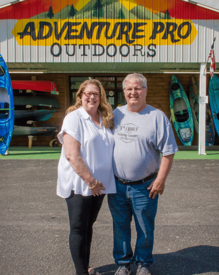 Owners of Adventure Pro Outdoors standing outside