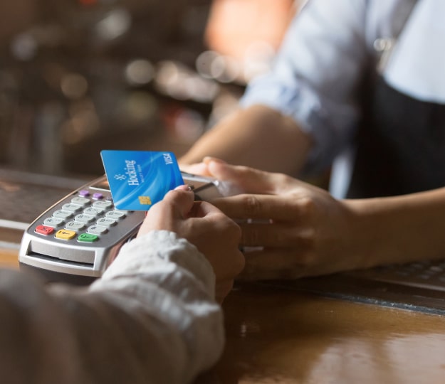 customer using debit card with merchant