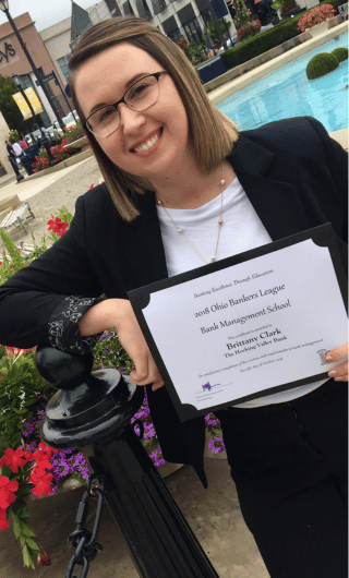 Brittany Clark receiving her bank management school diploma.