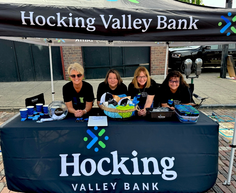 Group of bankers volunteering at a community event.