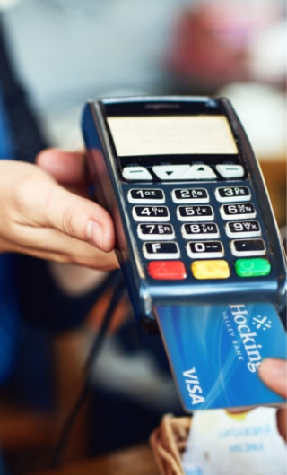 Customer using bank debit card with a merchant.